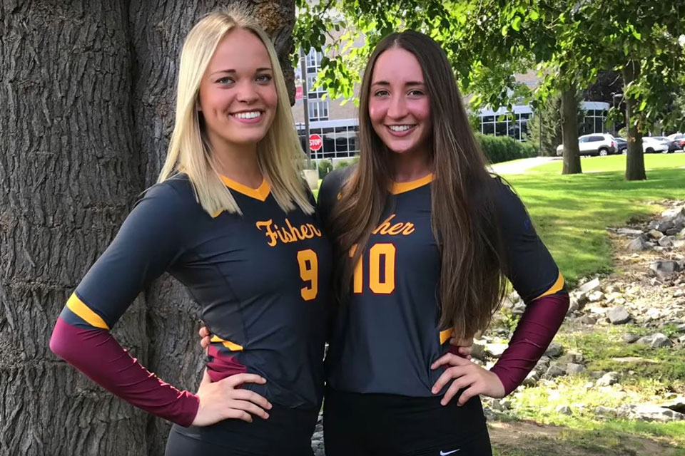 Emily Risch (left) with a volleyball teammate.